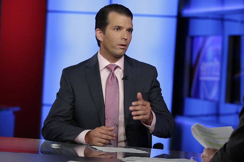 In this photo taken July 11, 2017, Donald Trump Jr. is interviewed by host Sean Hannity on his Fox News Channel television program, in New York. A Russian-American lobbyist says he attended a June 2016 meeting with President Donald Trump's son, marking another shift in the account of a discussion that was billed as part of a Russian government effort to help the Republican's White House campaign.  (AP Photo/Richard Drew)