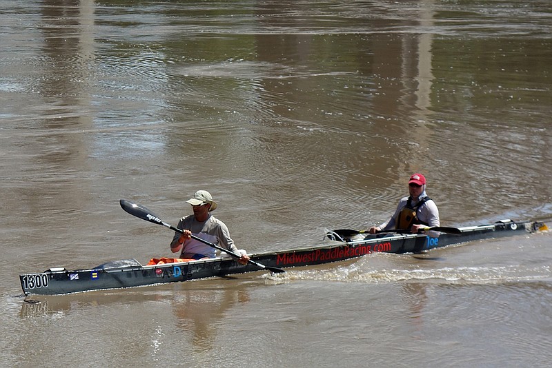 From left, Dylan McHarty and his partner Joe Mann, paddle to the finish line Saturday, July 15, 2017 during the Missouri River Freedom Race at the Noren River Access in Jefferson City. The duo finished first in the 63 mile race, a preliminary to the Missouri American Water MR340 on Aug 8-11.
