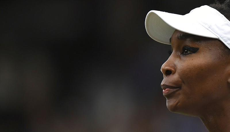 Venus Williams of the United States pauses between points as she plays Spain's Garbine Muguruza in the Women's Singles final match on day twelve at the Wimbledon Tennis Championships in London Saturday, July 15, 2017. 