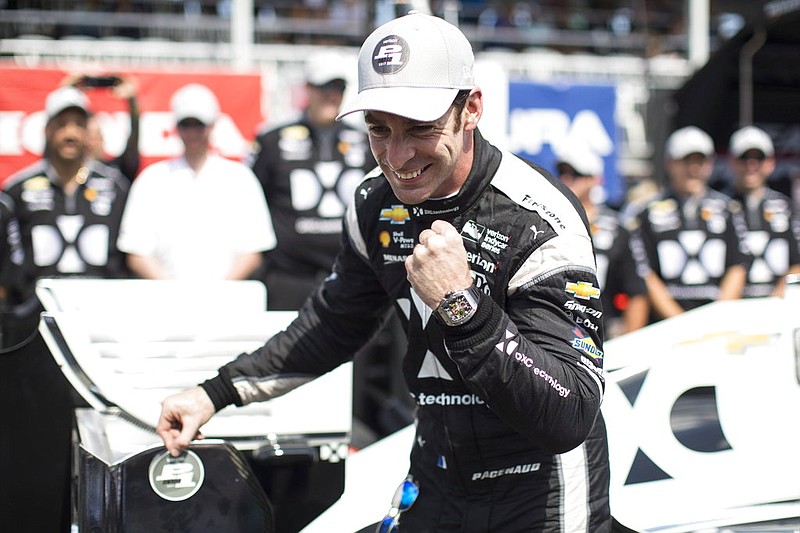 French driver Simon Pagenaud celebrates taking pole position during the qualifying session for the Honda Indy Toronto on Saturday, July 15, 2017. 