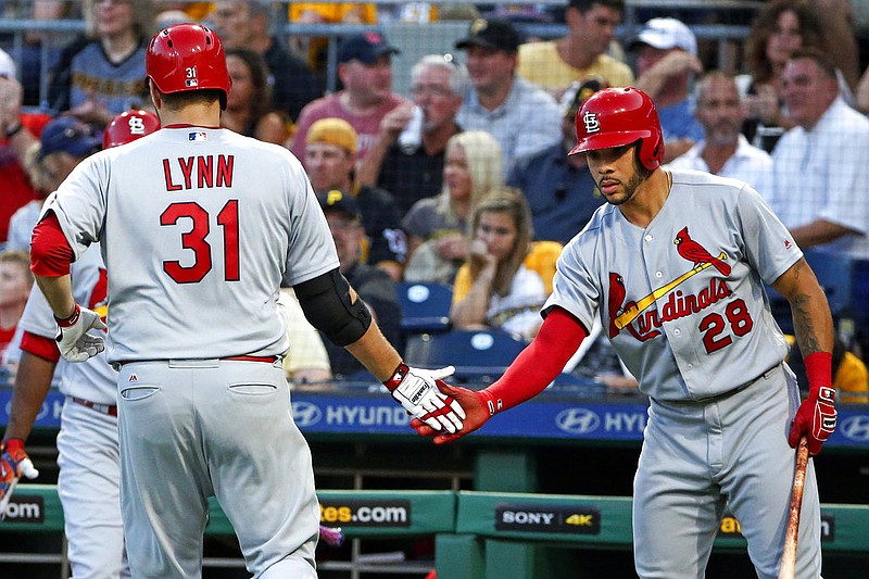 St. Louis Cardinals starting pitcher Lance Lynn (31) is greeted by Tommy Pham (28) after scoring on a single by Matt Carpenter off Pittsburgh Pirates starting pitcher Jameson Taillon in the fifth inning of a baseball game in Pittsburgh, Saturday, July 15, 2017. 