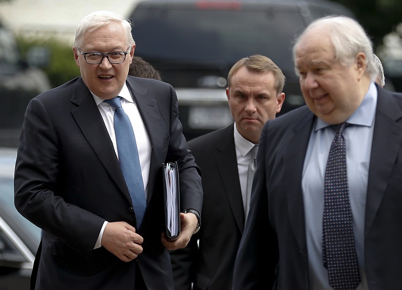 Russian Deputy Foreign Minister Sergei Ryabkov, left, and Russian Ambassador to the U.S. Sergey Kislyak, right, arrive at the State Department in Washington, Monday, July 17, 2017, to meet with Undersecretary of State Thomas Shannon. (AP Photo/Carolyn Kaster)