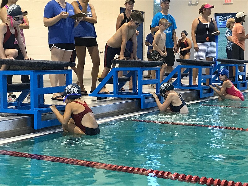 California Stingrays members Jana Lawson, Addison Fletcher, Ella Burger and Jackson Scrivner raced at the home swim meet at the California municipal pool July 12, 2017. (Submitted photo)