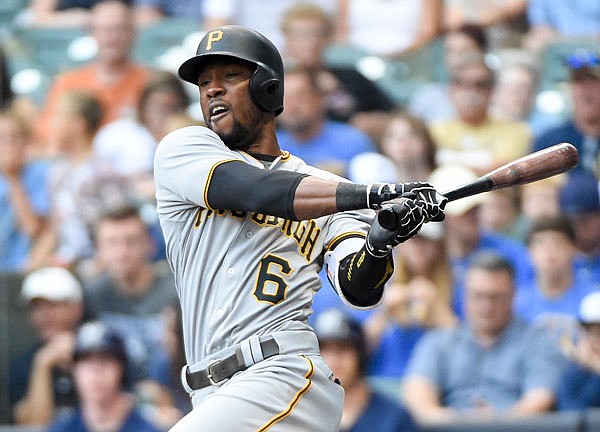 In this Aug. 27, 2016, file photo, Starling Marte of the Pirates follows through on an RBI double during the first inning of a game against the Brewers, in Milwaukee. Marte is eligible to return from his 80-game suspension today.