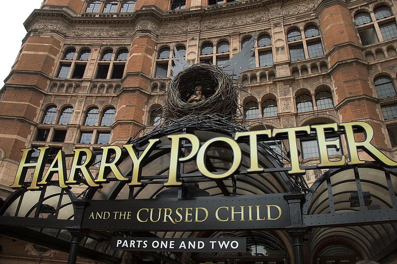 This July 30, 2016, file photo shows the Palace Theatre in Central London, which is showing a stage production of "Harry Potter and the Cursed Child." Harry Potter publisher Bloomsbury announced July 18, 2017, that two new books from the Harry Potter universe are set to be released in October as part of a British exhibition that celebrates the 20th anniversary of the launch of the series.