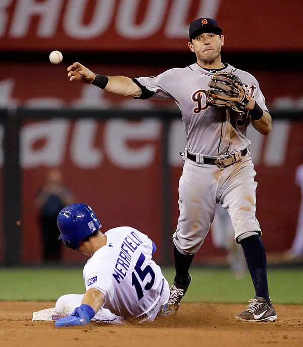 Tigers second baseman Ian Kinsler throws to first for the double play after forcing Whit Merrifield out at second to end the seventh inning of Tuesday night's game in Kansas City.