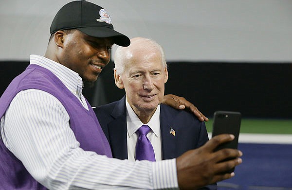 Kansas State head football coach Bill Snyder (right) visits with former player Victor Mann on Tuesday during the Big 12 football media day in Frisco, Texas.