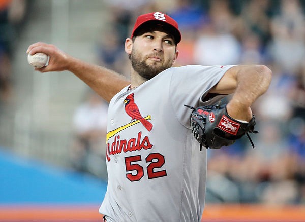 Cardinals starting pitcher Michael Wacha winds up during the first inning of Tuesday's game against the Mets in New York. Wacha pitched his first career shutout, leading the Cardinals to a 5-0 win.