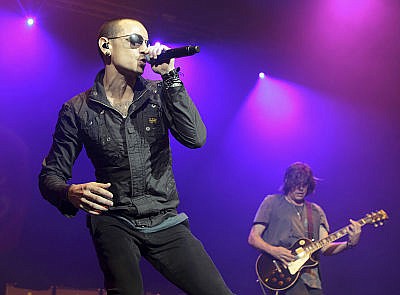 In this May 16, 2015, photo, Chester Bennington, left, performs during the MMRBQ Music Festival 2015 at the Susquehanna Bank Center in Camden, N.J. The Los Angeles County coroner says Bennington, who sold millions of albums with a unique mix of rock, hip-hop and rap, has died in his home near Los Angeles. He was 41. Coroner spokesman Brian Elias says they are investigating Bennington's death as an apparent suicide but no additional details are available.