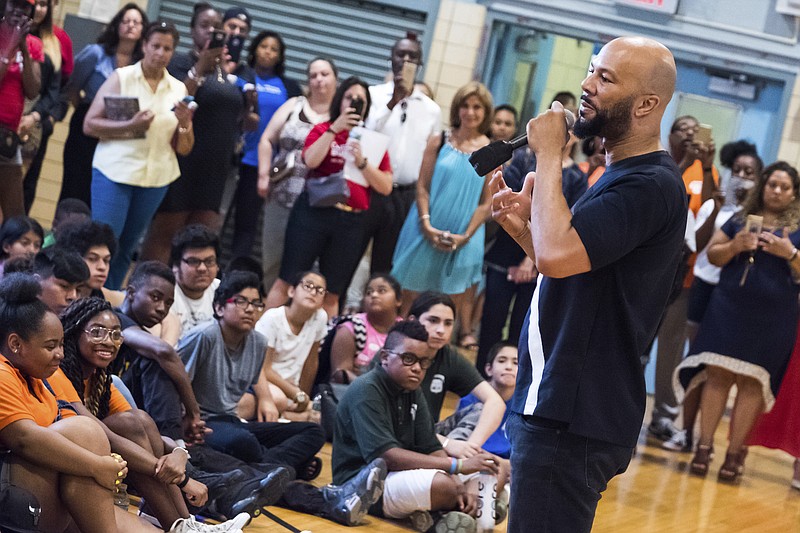 Musician and actor Common visits the Renaissance School of the Arts as Ambassador for AdoptAClassroom.org and Burlington Stores on Thursday, July 20, 2017, in New York. Common will be fulfilling all the wish lists that teachers and faculty put together for the school's needs for the upcoming year. (Photo by Charles Sykes/Invision/AP)