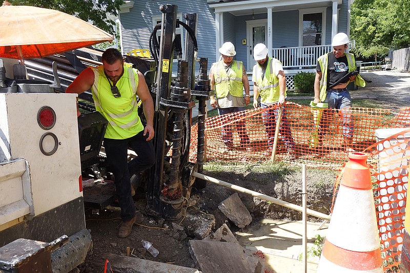 <p>Jenny Gray/FULTON SUN</p><p>With wicked humidity and the temperature breaking 100 degrees in downtown Fulton, four MasTec Engineering workers attempt to install new AT&T cables on West 7th Street. Caleb Limberopoulos, Devin Dunham, Jared Hawkins and Josh Mcgowan check their work with a ditch witch inbetween breaks. ‘We’re drinking water and finding shade,’ Dunham said, to which Mcgowan added, ‘There’s not much of it, but we’re trying.’ The heat spell might end Saturday night.</p>