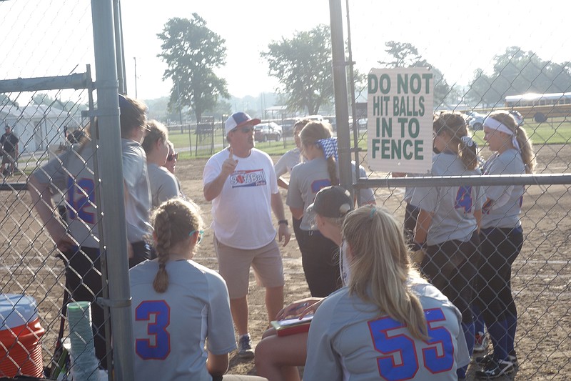 California softball players gather around before the start of the second inning Thursday, July 20, 2017 during a scrimmage at Versailles.