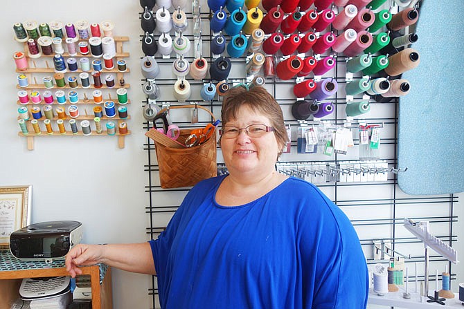 Barbara Turner keeps a rainbow of thread on hand at her shop, Mama's Mend N Sew. She provides a variety of alteration services including attaching patches, adding zippers and removing sleeves.