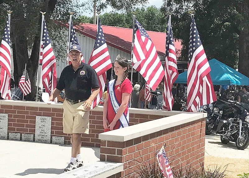 Don Dettmann of the AMVETS Post 153 and Katie Bernicky, 12, the 2017 Missouri Young Miss crown holder, dedicate a memorial wall Saturday in Mokane. Bernicky has single-handedly raised enough money to send 19 veterans to Washington, D.C., via the Central Missouri Honor Flight program.