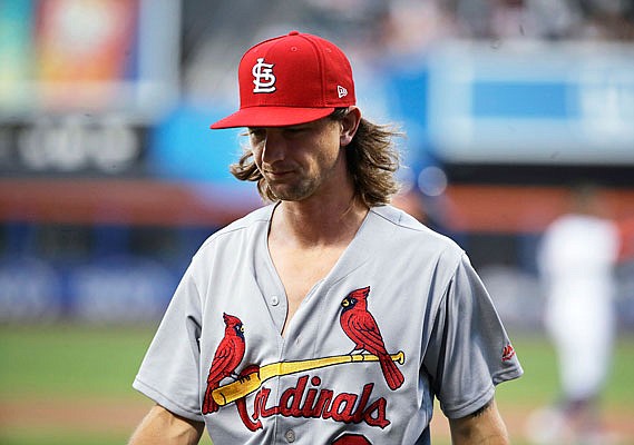 Cardinals starting pitcher Mike Leake leaves the field during the first inning of Wednesday night's game against the Mets in New York. Leake game up seven runs in two innings.
