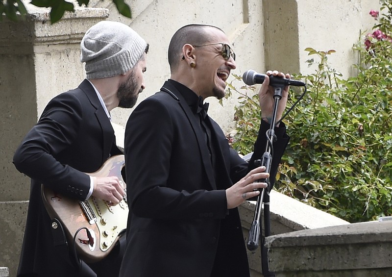 In this May 26, 2017 file photo, Chester Bennington, of Linkin Park, performs "Hallelujah" at a funeral for Chris Cornell at the Hollywood Forever Cemetery in Los Angeles. The Los Angeles County coroner says Bennington, who sold millions of albums with a unique mix of rock, hip-hop and rap, has died in his home near Los Angeles. He was 41. Coroner spokesman Brian Elias says they are investigating Bennington's death as an apparent suicide, but no additional details are available.