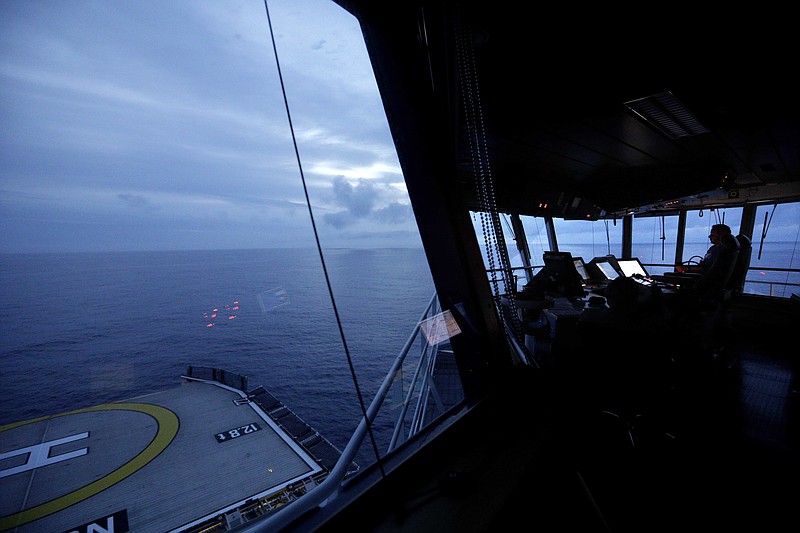 First officer Jukka Alhoke sits at the controls of the Finnish icebreaker MSV Nordica on Thursday, July 6, 2017, as it sets sail off the coast of Canada toward the Bering Strait. The MSV Nordica is setting course to traverse the Northwest Passage, a route once considered impassible, from the Pacific ocean to the Atlantic via the Arctic. The icebreaker, which is returning to its home port of Helsinki, is carrying researchers studying the impact of the Arctic's melting sea ice on the fragile social and ecological balance in the region, and observers from the U.S. and Canadian Coast Guards.