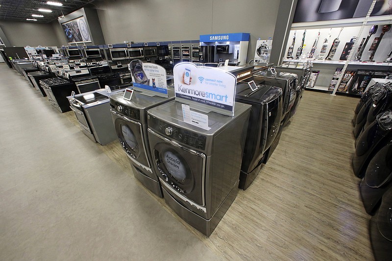 The Kenmore Elite Smart electric dryer and front-load washer, center, appear on display Thursday, July 20, 2017, at a Sears store in West Jordan, Utah. Sears will begin selling its appliances on Amazon.com, including smart appliances that can be synced with Amazon's voice assistant, Alexa.