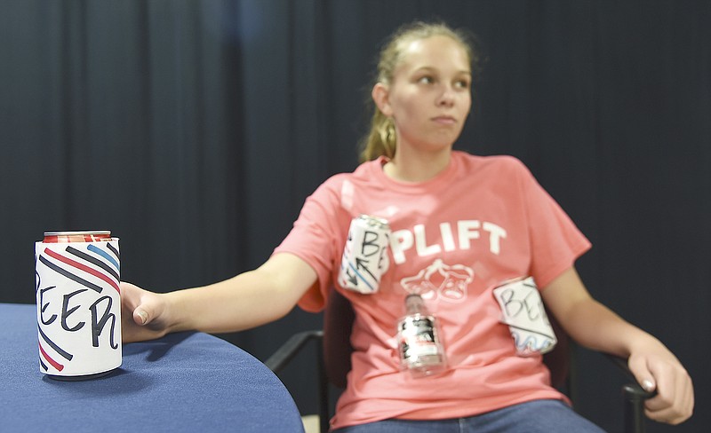 Kennedy Voss, a student from UPLIFT, awaits her turn in front of the green screen during which she'll act out a scene about the dangers of underage drinking. UPLIFT is a group of incoming freshmen who mentor area sixth-graders about the dangers of underage drinking, drug use and bullying.