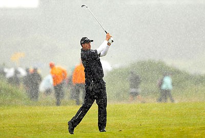 Henrik Stenson plays a shot on the 10th hole Friday in heavy rain during the British Open at Royal Birkdale in Southport, England.