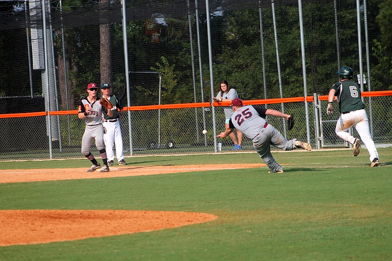 Texarkana pitcher Hunter Lewis flips to first to get an out on a bunt in the sixth inning during the American Legion Arkansas state tournament Saturday at Hendrix College. The Razorbacks came from behind to win, 6-5.