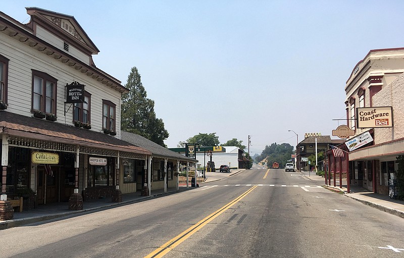 <p>AP</p><p>The evacuated downtown of Mariposa, Calif., is seen last week as firefighters battle a large wildfire in the surrounding hills and mountains. Mariposa normally bustles with tourists on their way to Yosemite National Park.</p>