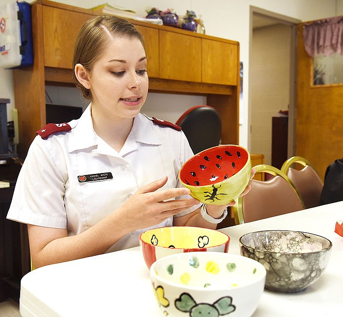 Lt. Rachel White of the Salvation Army Center of Hope tells how impressed she is with the bowls made to the Empty Bowl fundraiser soup lunch on Aug. 1 at Windstone Entertainment on Industrial Drive.