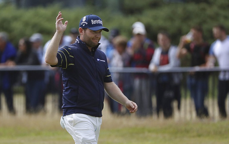 South Africa's Branden Grace waves as he makes his way along the 18th fairway during the third round of the British Open Golf Championship, at Royal Birkdale, Southport, England, Saturday July 22, 2017. 