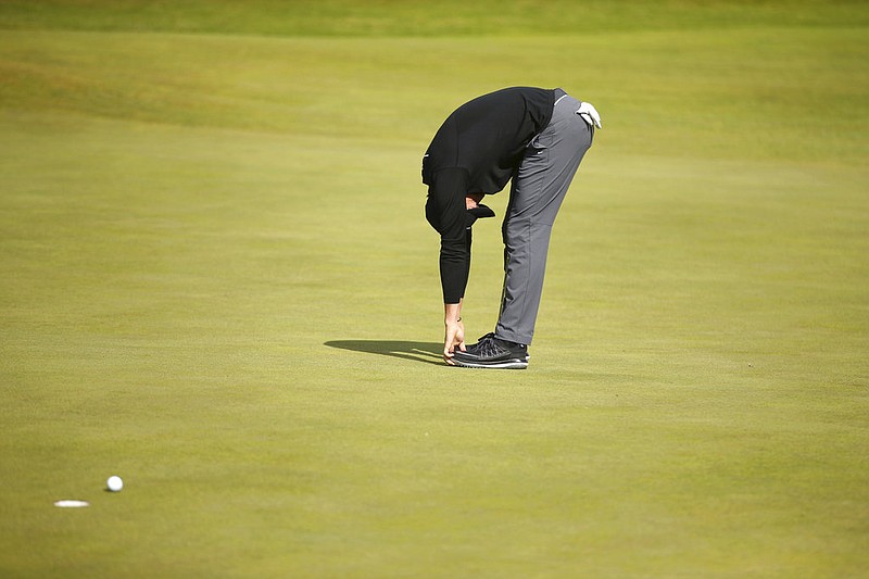 Northern Ireland's Rory McIlroy reacts to a missed putt during the third round of the British Open Golf Championship, at Royal Birkdale, Southport, England, Saturday July 22, 2017. 