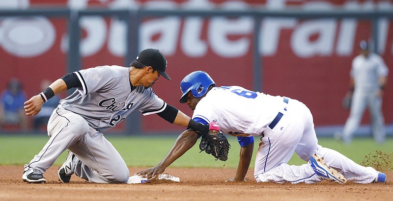 Kansas City Royals' Lorenzo Cain (6) steals second base as Chicago White Sox shortstop Tyler Saladino (20) places the late tag during the fifth inning of a baseball game at Kauffman Stadium in Kansas City, Mo., Saturday, July 22, 2017.