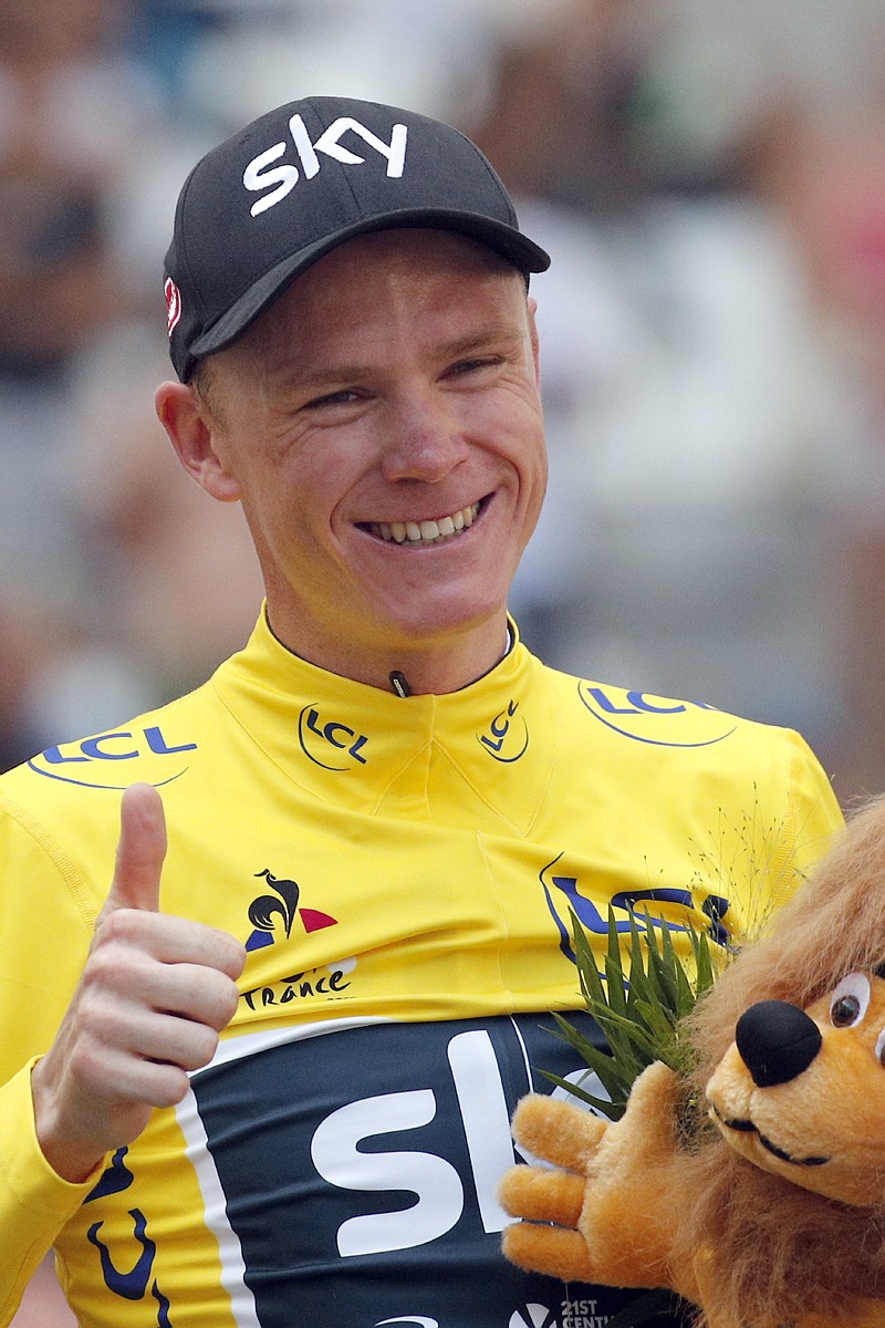 Britain's Chris Froome celebrates on the podium after the twentieth stage of the Tour de France in Marseille, southern France.