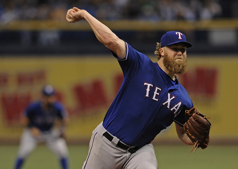 Texas Rangers starter Andrew Cashner pitches against the Tampa Bay Rays during the first inning of a baseball game Saturday in St. Petersburg, Fla. 