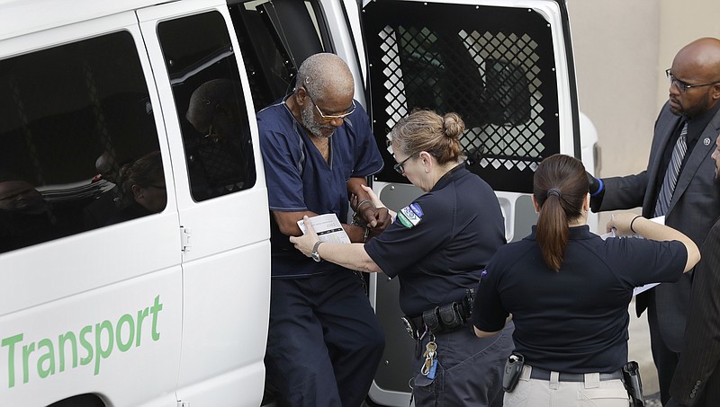 <p>AP</p><p>James Mathew Bradley Jr., 60, of Clearwater, Florida, left, arrives at the federal courthouse for a hearing Monday in San Antonio. Bradley was taken into custody and is expected to be charged in connection to the people who died after being crammed into a sweltering tractor-trailer found parked outside a Walmart in the midsummer Texas heat. Sunday.</p>
