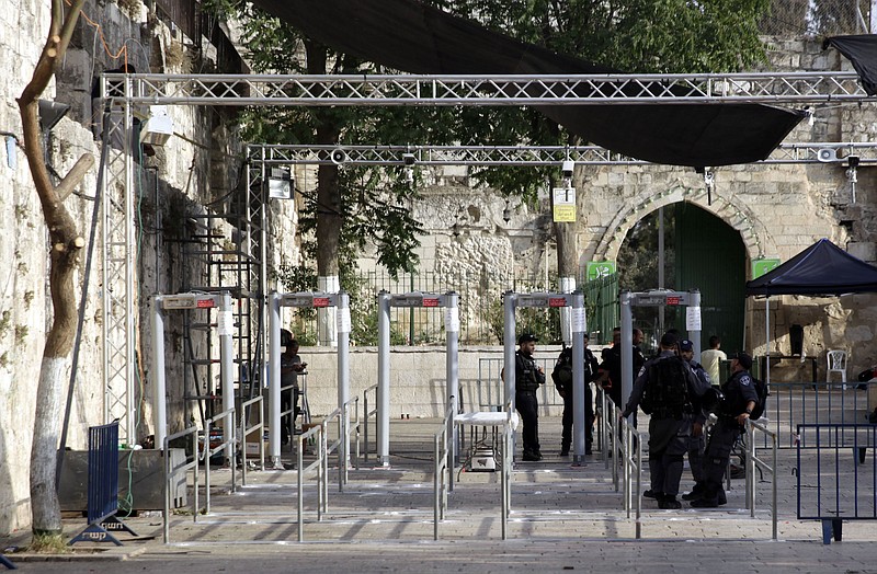 Israeli police officers are seen outside the Al Aqsa Mosque compound in Jerusalem's Old City, Monday, July 24, 2017. Israeli media reports high resolution cameras placed around Jerusalem's Old City walls could replace the metal detectors that sparked Muslim outrage after they were set outside entrances to a major shrine. (AP Photo/Mahmoud Illean)