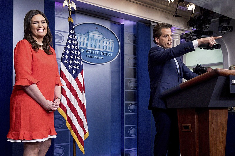 White House Communications Director Anthony Scaramucci, right, accompanied by newly appointed White House press secretary Sarah Huckabee Sanders, left, calls on a member of the media during the daily press briefing Friday in Washington