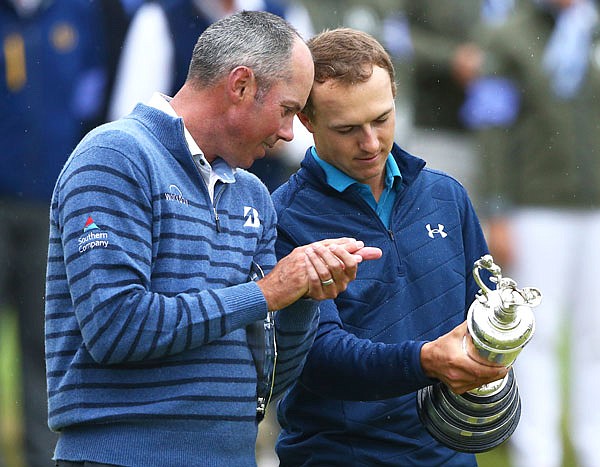 British Open champion Jordan Spieth (right) and runner-up Matt Kuchar look at the trophy after Sunday's final round at Royal Birkdale in Southport, England.