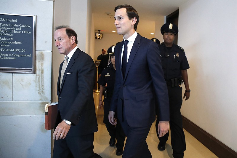 White House adviser Jared Kushner, center, and his attorney Abbe Lowell, left, arrive on Capitol Hill in Washington, Tuesday, July 25, 2017, to be interviewed behind closed doors by the House Intelligence Committee. (AP Photo/Jacquelyn Martin)
