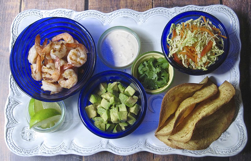 Crispy Shrimp Tacos with Cole Slaw and Chipotle Cream.