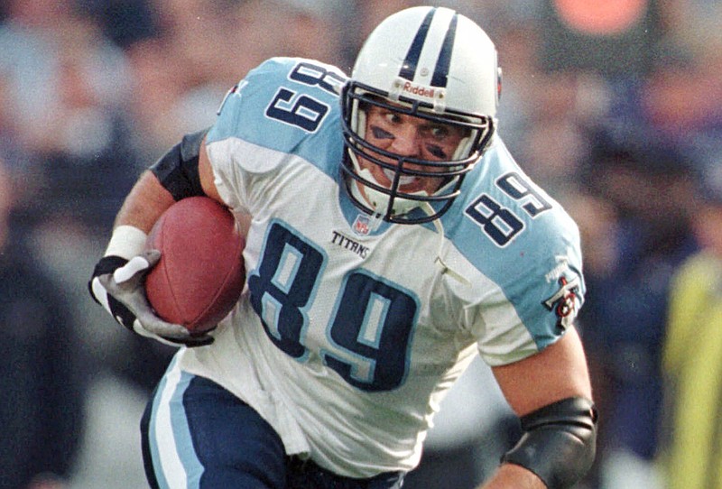 This Sunday, Dec. 5, 1999, file photo shows Tennessee Titans tight end Frank Wycheck during a football game against the Baltimore Ravens in Baltimore. Wycheck worries that concussions during his nine-year career have left him with chronic traumatic encephalopathy and he plans to donate his brain to research. "Some people have heads made of concrete, and it doesn't really affect some of those guys," he said. "But CTE is real."