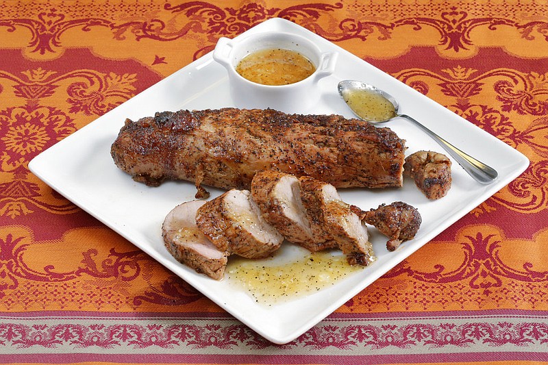 This May 24, 2017 photo shows crusty pork tenderloin, made with a barbecue rub of dark brown sugar, salt, pepper and paprika, at the Institute of Culinary Education in New York. This dish is from a recipe by Elizabeth Karmel. 