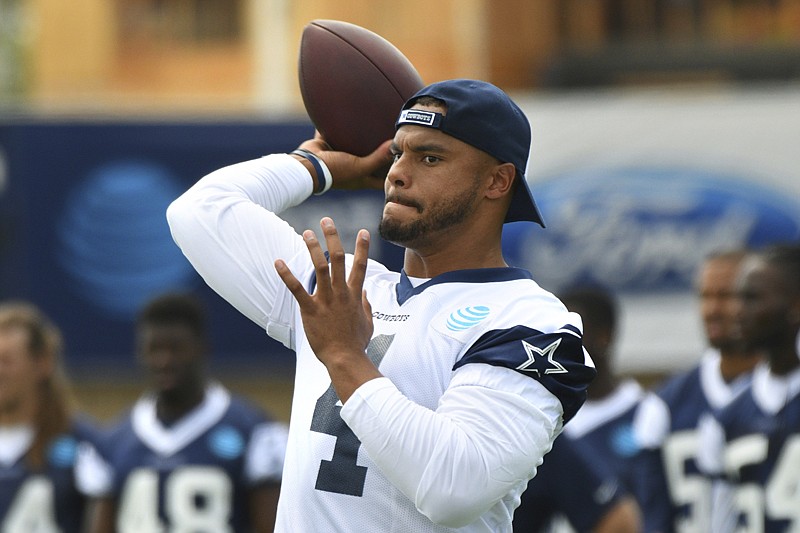 Dallas Cowboys quarterback Dak Prescott (4) passes during practice Monday at the NFL football team's training camp in Oxnard, Calif.