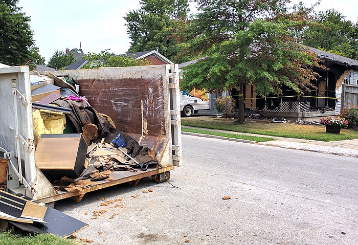 Debris from the burned duplex at 903 Nichols St. is piled right across the road from 906 Nichols St., which was damaged in a Monday fire. The two incidents are unrelated, Fire Chief Kevin Coffelt said.