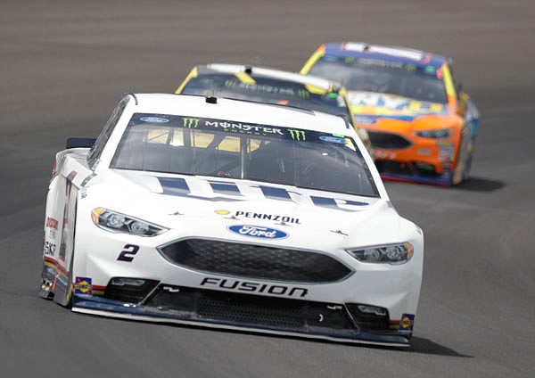 Brad Keselowski drives into turn one during Sunday's Brickyard 400 at Indianapolis Motor Speedway. Keselowski has signed a multiyear deal to stay with Team Penske.