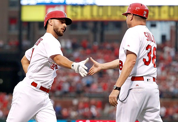 AP
Paul DeJong of the Cardinals is congratulated by third base coach Mike Shildt after hitting a two-run home run during the first inning of Wednesday night's game against the Rockies at Busch Stadium. 