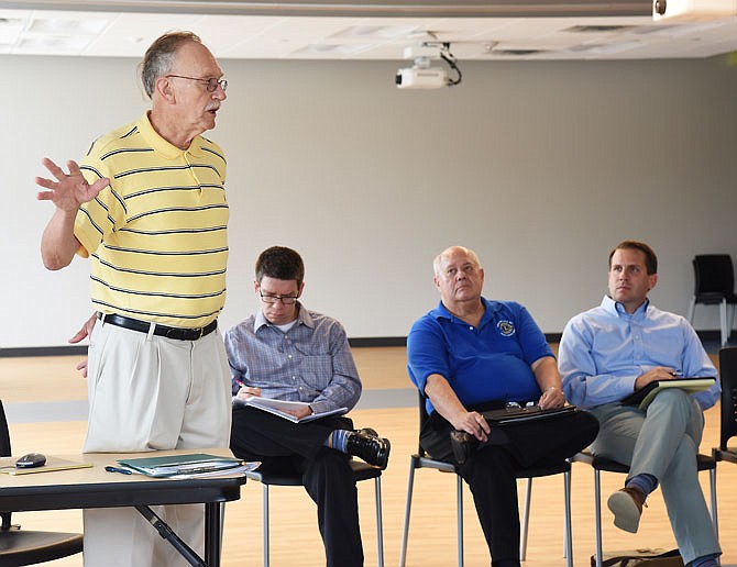 Jeff Holzem, left, makes a presentation Wednesday to the Jefferson City Environmental Quality Commission about making the community more energy efficient. Seated from left are Transportation Planner Alex Rotenberry and City Councilmembers Mark Schreiber and Ken Hussey.