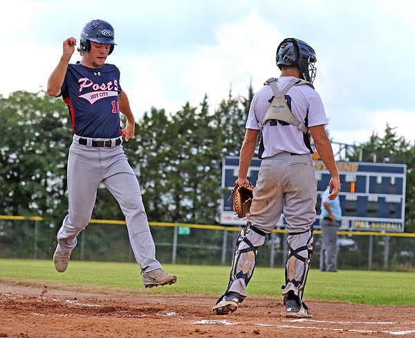 Zach Stiles of Post 5 scores a run against Columbia Post 202 during the district championship game July 14 at the American Legion Post 5 Sports Complex. 