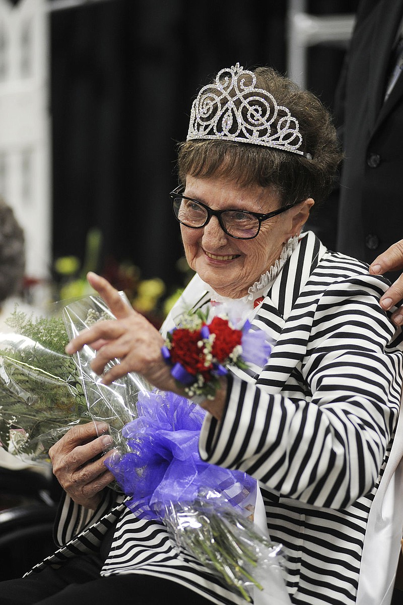 Virginia Libbert points at a friend in the crowd after being crowned queen during the District 7 Ms. Missouri nursing Home Pageant at Capital West Christian Church event center in Jefferson City on Thursday, July 27, 2017. Libbert, who represented Villa Marie nursing home, will go to Branson in August to represent the district in the statewide pageant. 