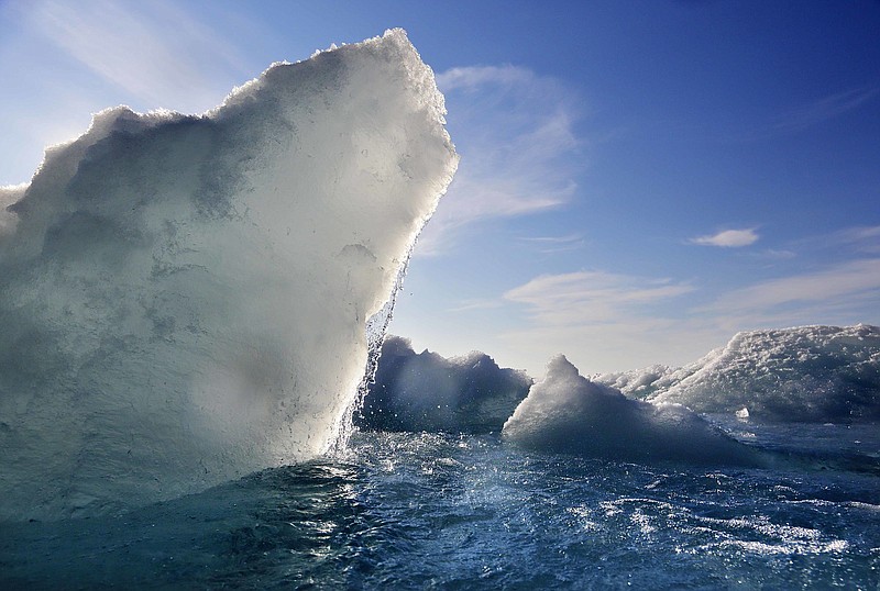 Broken sea ice emerges Friday, July 21, 2017, from under the hull of the Finnish icebreaker MSV Nordica as it sails through the Victoria Strait while traversing the Arctic's Northwest Passage.