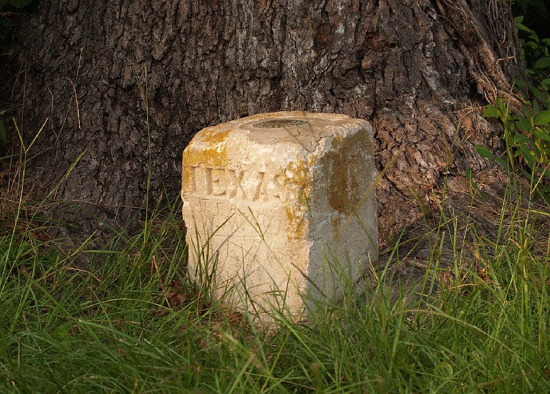 The U.S. Coast and Geodetic Survey triangulation benchmark at Three States is the only way one would know this is the precise point at which Texas, Arkansas and Louisiana meet.