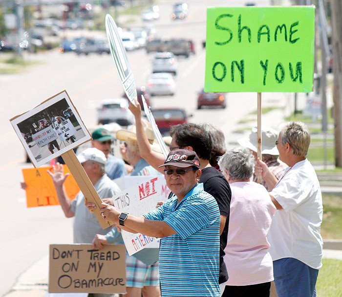 Jefferson City resident Lhakpa Tsering and other Mid-Missourians gathered Saturday, July 29, 2017 outside the office of Congressman Blaine Luetkemeyer to protest health care reform. Some of those present were part of Jefferson City Area Indivisible and Capital Area Missouri NOW.